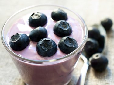 Blueberry yogurt in a glass close up