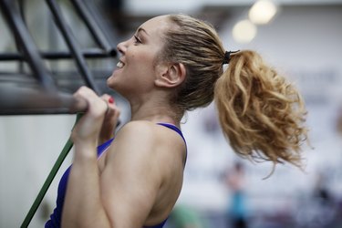 Young woman training in crossfit center