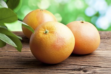 Grapefruits on a wooden table.