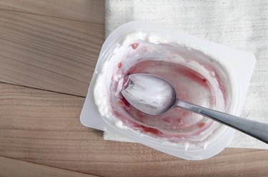 empty plastic container of yogurt