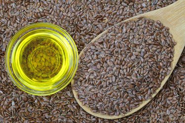 Cold pressed Linseed yellow oil on flax seeds