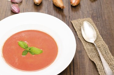 Is Tomato Soup Good for You? Tomato soup with basil and a spoon