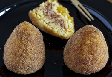 typical italian food: sicilian food called "arancini"