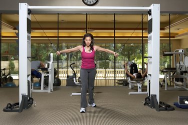 Young woman doing exercise in gym