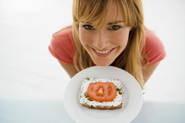 Woman eating sandwich