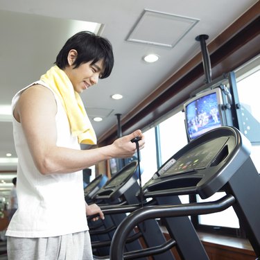 a running man on a running machine at a fitness club