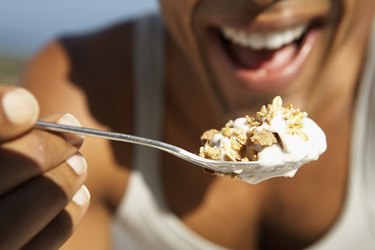Man Eating Granola with Yogurt