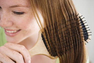 Woman combing her hair