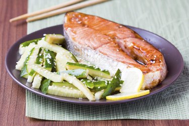 Red fish grilled salmon with cucumber salad, soy sauce, Japan