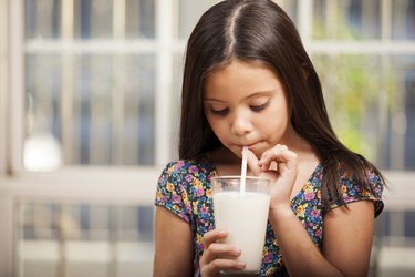 Drinking milk with a straw