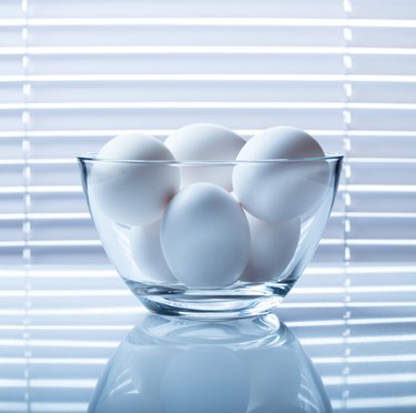 Eggs bowl on reflective plate