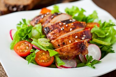 Fresh vegetable salad with grilled chicken breast