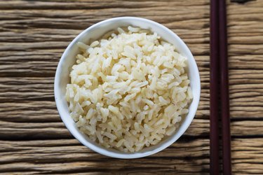 Bowl of brown rice with chopsticks