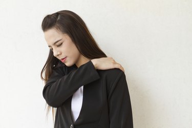 shoulder pain or stiffness of female business executive