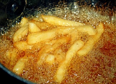 French Fries Cooking In Deep Fryer