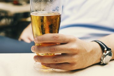 Man holding a glass of beer