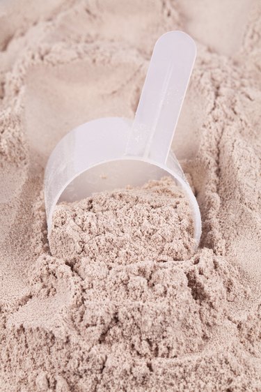 Scoop of chocolate whey isolate protein