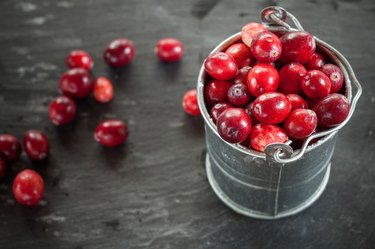 Cranberries in small zinc bucket