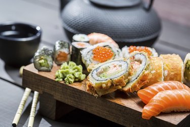 Closeup of fresh sushi on wooden board