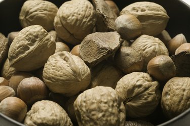 Mixed edible nuts in shells close-up