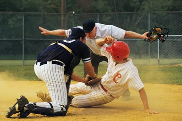 Man sliding into home plate