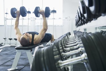 Middle Eastern man exercising with dumbbells