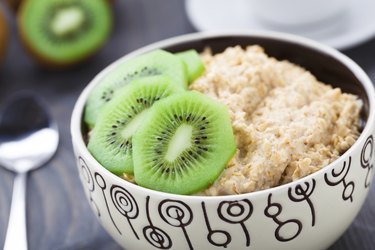 Bowl of oats porridge with kiwi