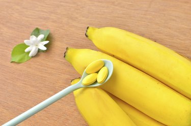 Vitamin tablet on banana