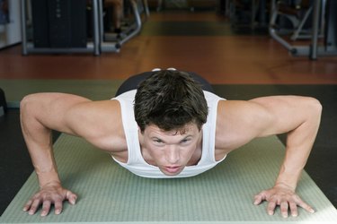 Mid adult man doing push-ups