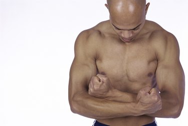 Young man flexing his biceps