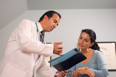 Doctor explaining x-ray to patient