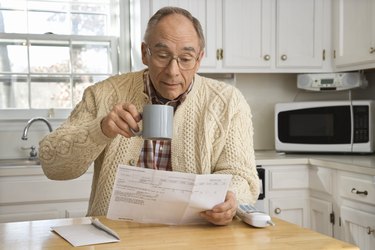 Man with coffee and mail