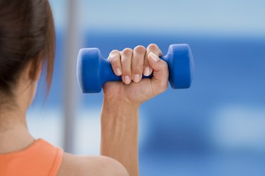 Woman holding free weight