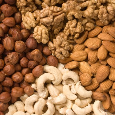 Different nuts (almonds, cashews, walnuts and filbers) close up