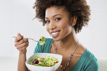 African American Woman Eating Salad