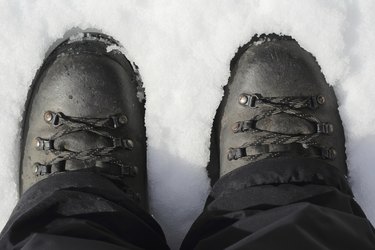 Hiking boots on snow, top view