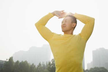 Young Muscular Man Stretching