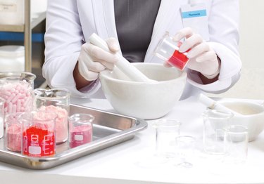 pharmacist preparing medication with mortar