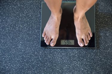 Standing on weight scale