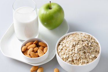 "Oatmeal with almonds,apple and glass of milk"