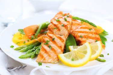 grilled salmon with asparagus  on white plate