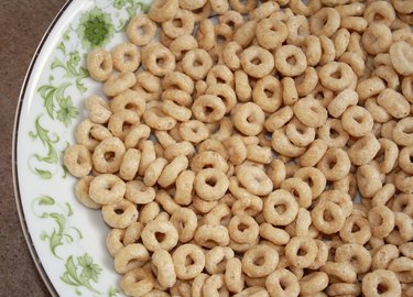 Dry wholegrain cheerios in a cereal bowl