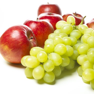 Apples and Muscat grapes, white background
