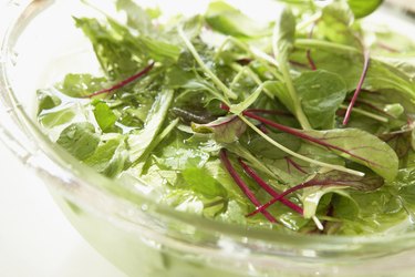 Lettuce in bowl of water, close up