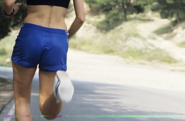 Jogger on road, Murcia, Spain