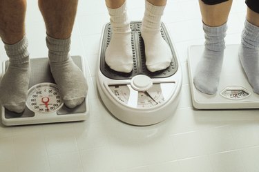 People standing on bathroom scales