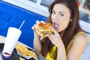 Woman Eating a Delicious Hamburger