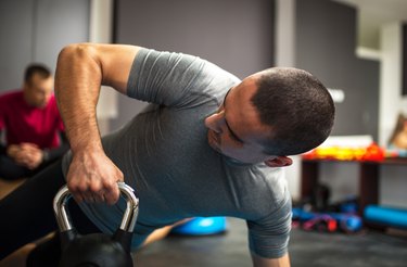 Man lifting dumbbell