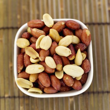 Elevated view of a bowl of salted peanuts