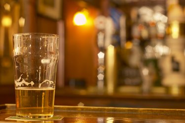 Glass of beer on bar counter top